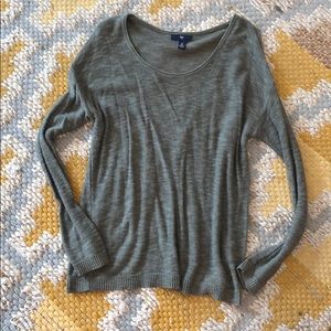 Light earthly green sweater.